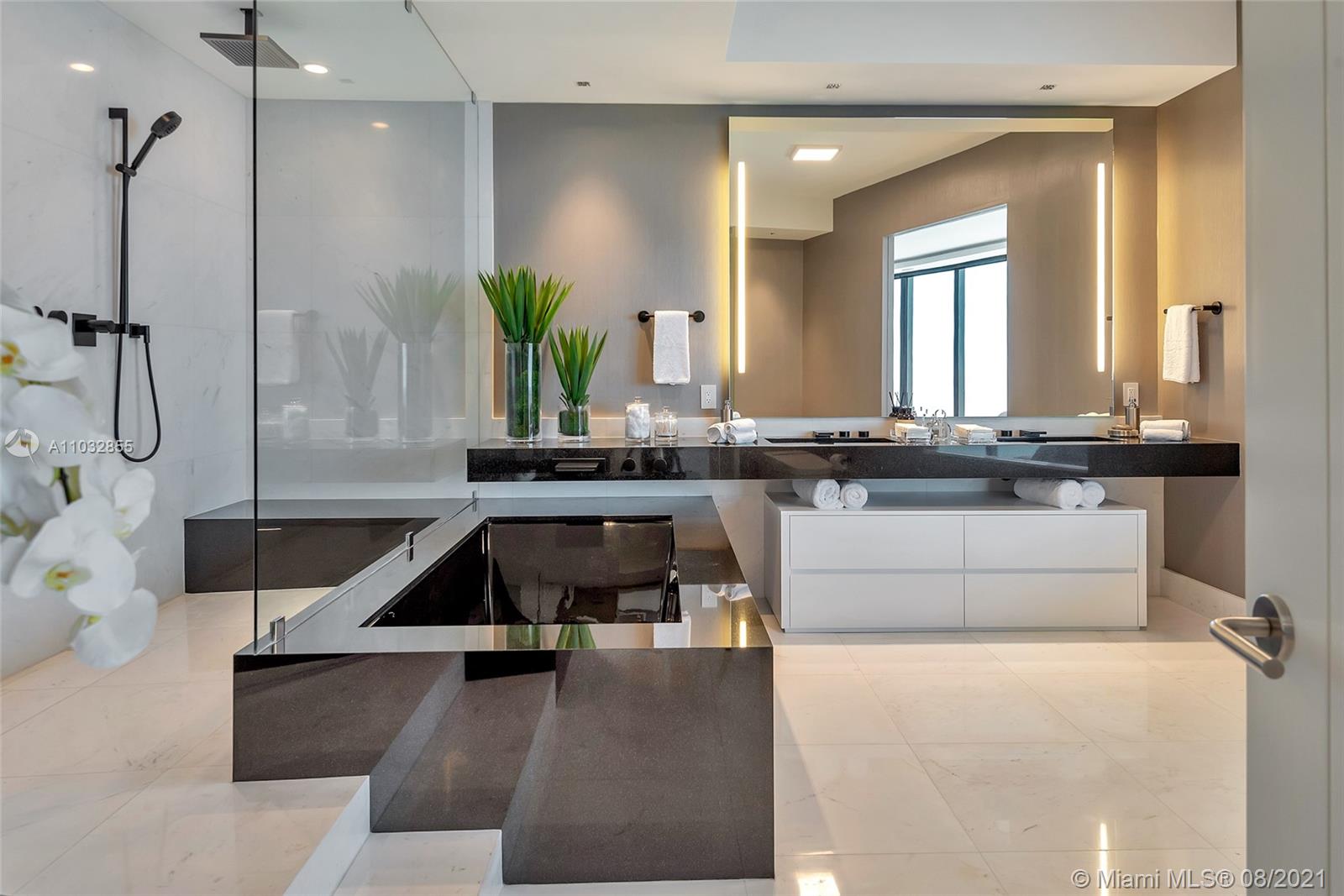 North Biscayne Beach Sunny Isles Beach, FL 33160 - Photo 22 of 52 a living room with a table and chairs