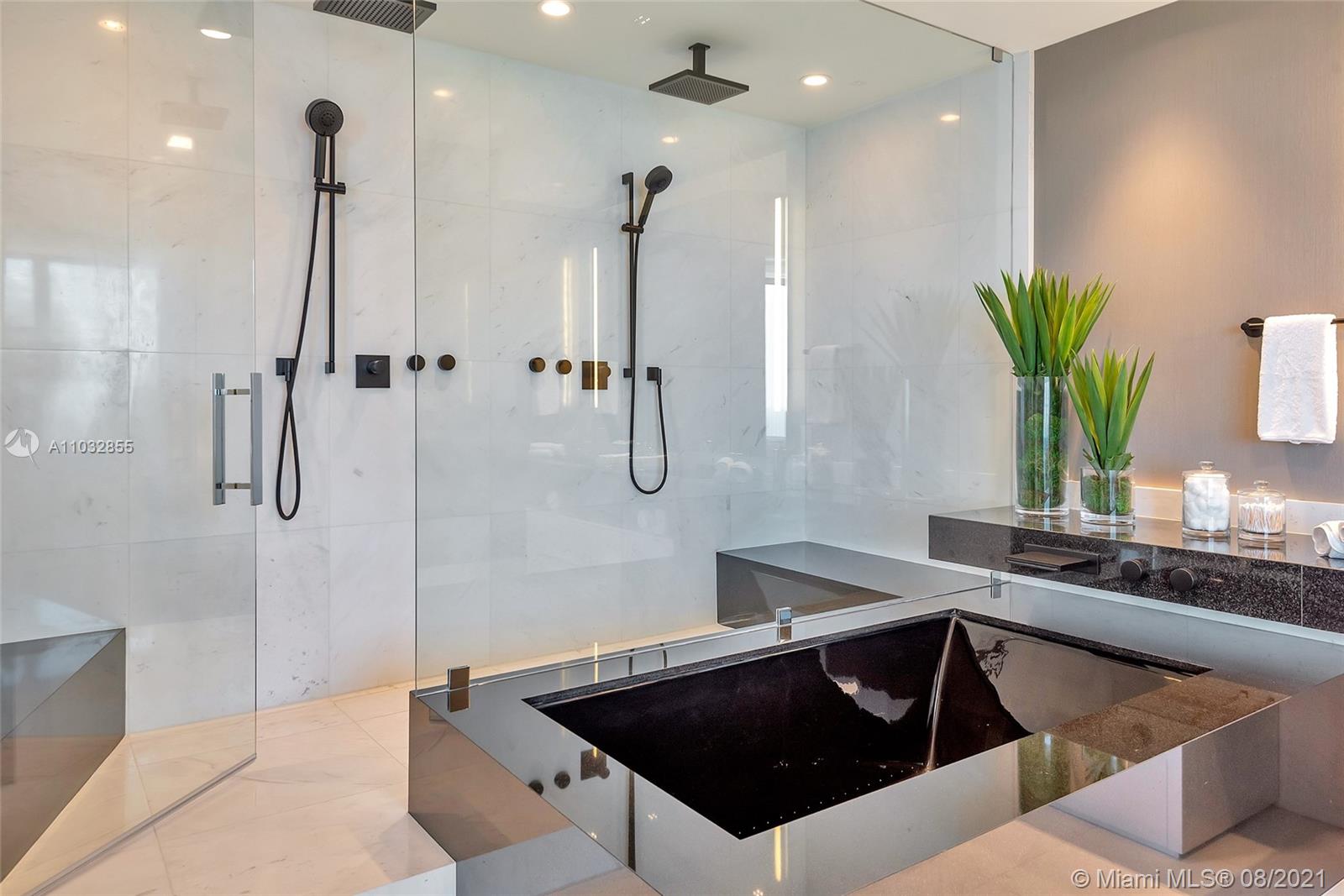 North Biscayne Beach Sunny Isles Beach, FL 33160 - Photo 24 of 52 a kitchen with a sink a counter and cabinets