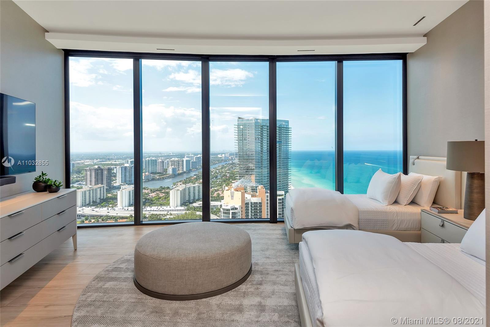 North Biscayne Beach Sunny Isles Beach, FL 33160 - Photo 25 of 52 a living room with couch and a large window