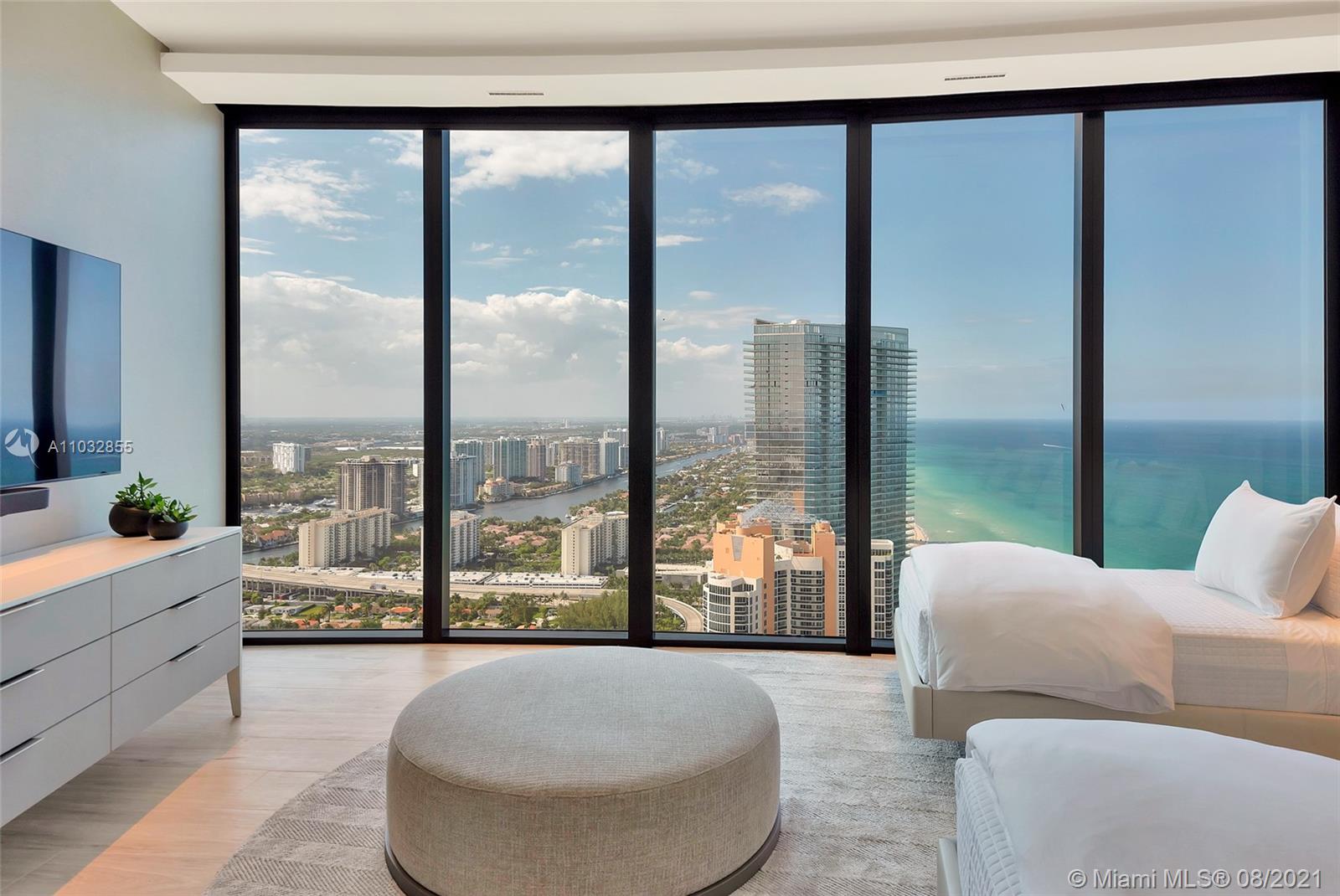 North Biscayne Beach Sunny Isles Beach, FL 33160 - Photo 27 of 52 a living room with couch and a large window