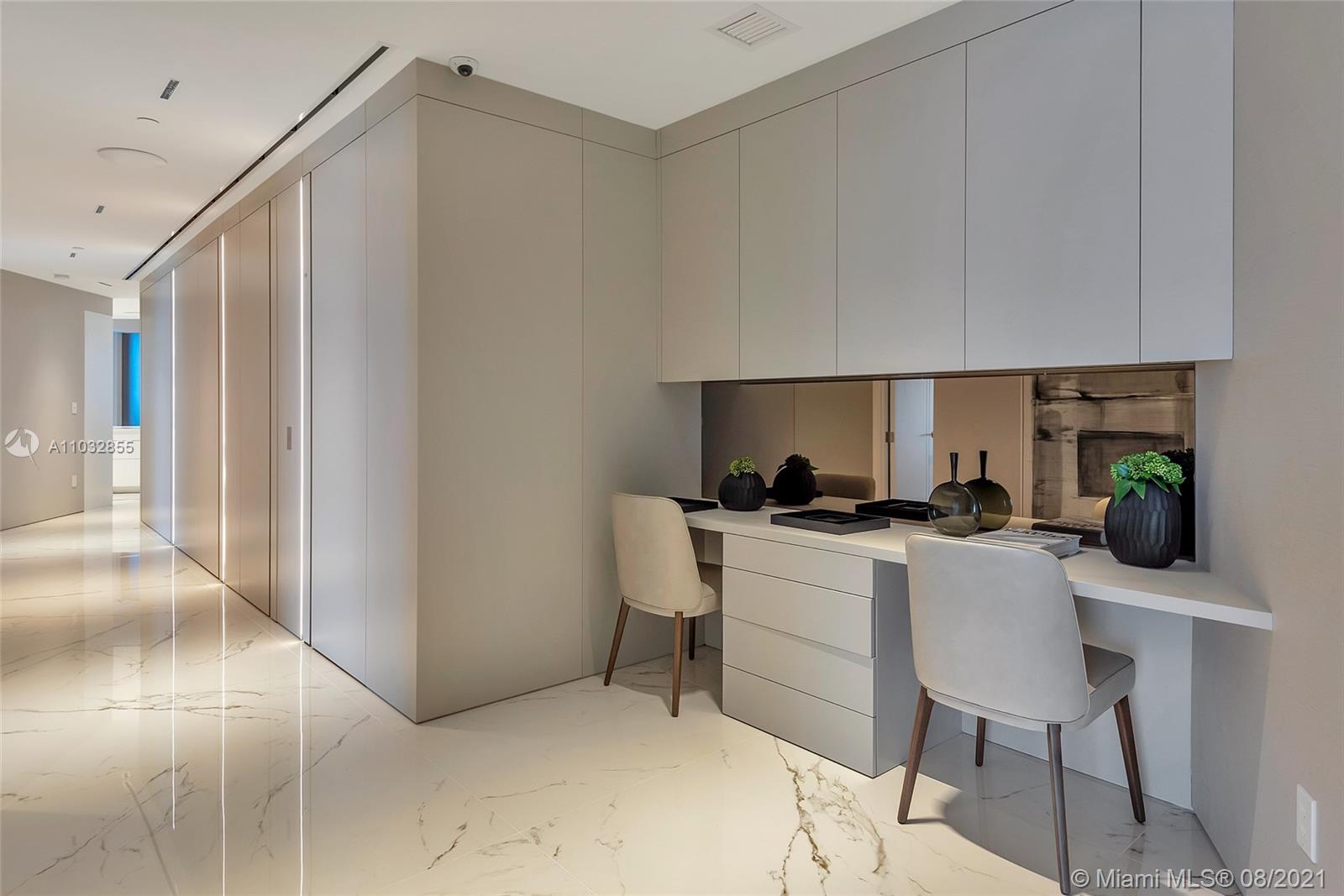 North Biscayne Beach Sunny Isles Beach, FL 33160 - Photo 29 of 52 a kitchen with a sink cabinets and wooden floor