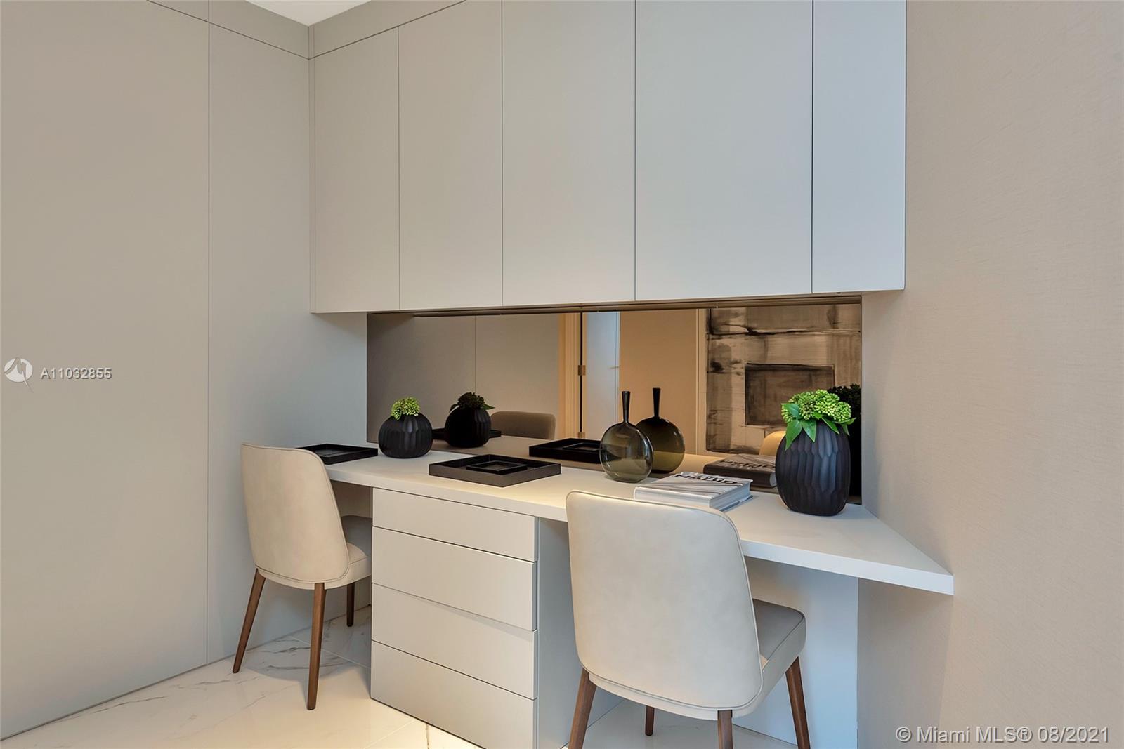 North Biscayne Beach Sunny Isles Beach, FL 33160 - Photo 30 of 52 a table with chairs and white cabinets