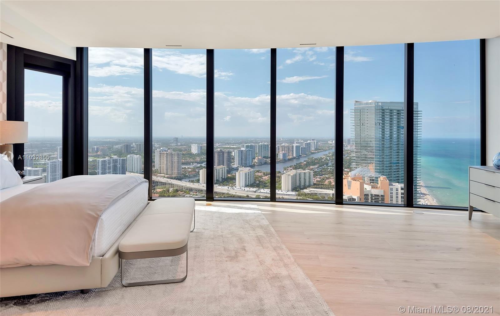 North Biscayne Beach Sunny Isles Beach, FL 33160 - Photo 31 of 52 a large bedroom with a large window and a bed