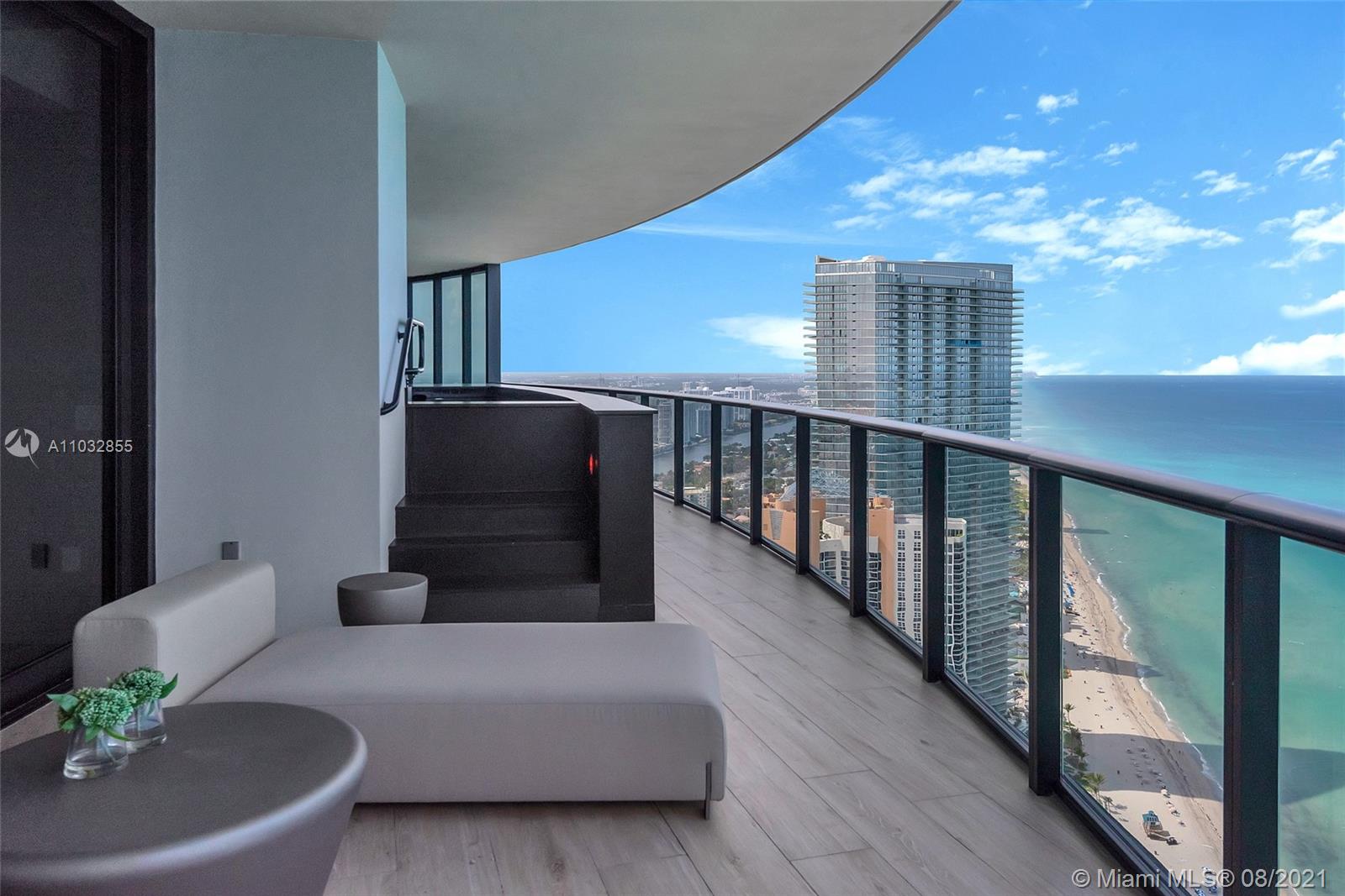 North Biscayne Beach Sunny Isles Beach, FL 33160 - Photo 5 of 52 a living room with furniture and a potted plant