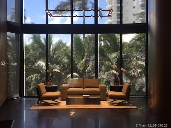 North Biscayne Beach Sunny Isles Beach, FL 33160 - Photo 48 of 52 a living room with furniture and a floor to ceiling window