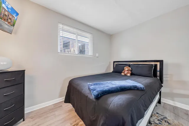 a bedroom with a bed and window