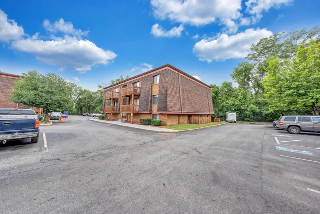 a view of street with parked cars