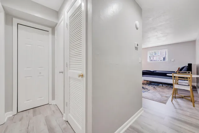 a view of workspace with furniture and wooden floor