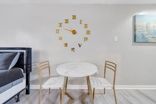 a bedroom with a bed and a chair