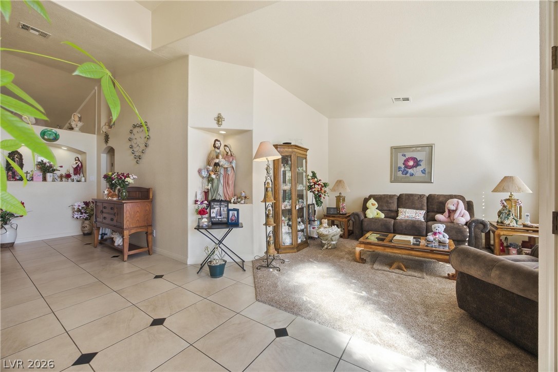 6109 Ocho Rios Street Las Vegas, NV 89130 - Photo 16 of 36 Living area featuring light tile patterned flooring