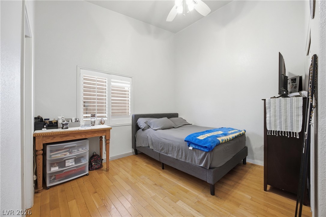 6109 Ocho Rios Street Las Vegas, NV 89130 - Photo 28 of 36 Bedroom featuring light wood finished floors and ceiling fan