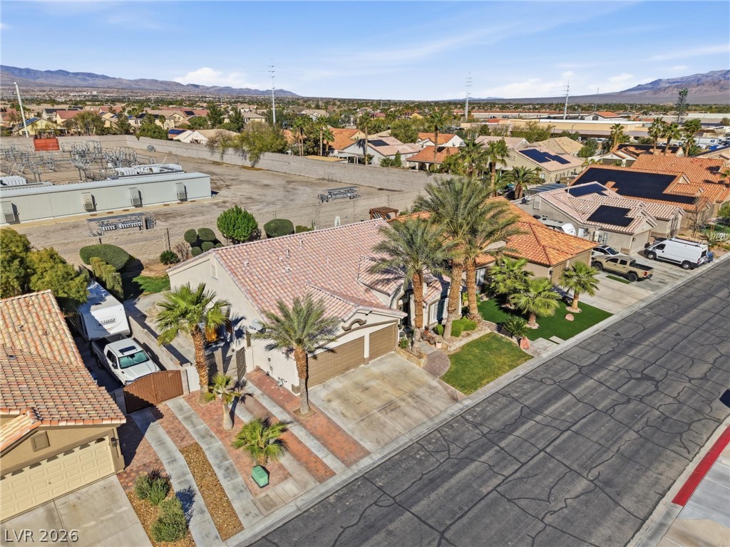 6109 Ocho Rios Street Las Vegas, NV 89130 - Photo 30 of 36 Aerial view of residential area with a mountainous background