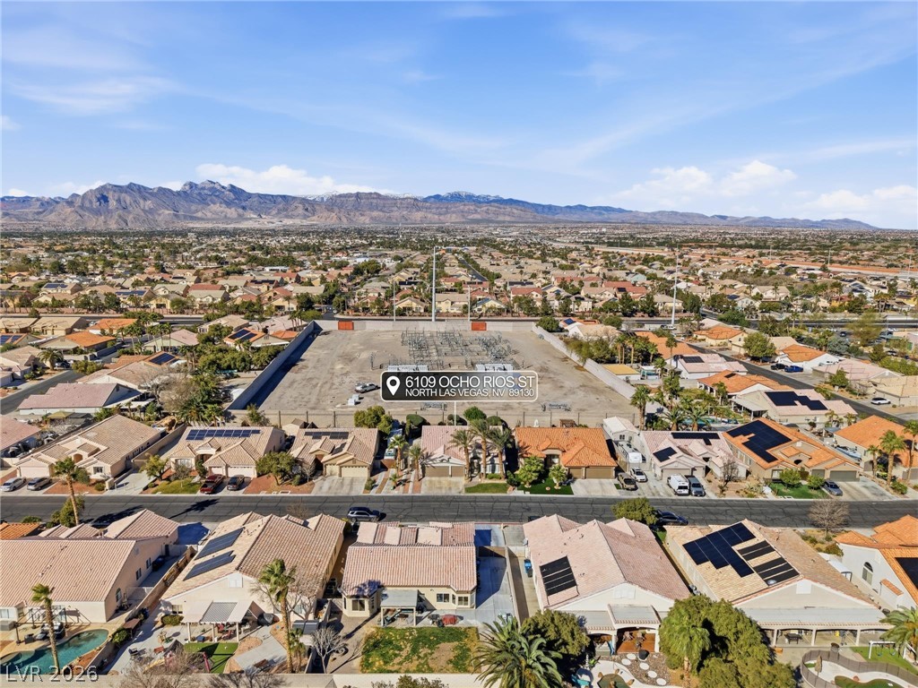 6109 Ocho Rios Street Las Vegas, NV 89130 - Photo 33 of 36 Aerial perspective of suburban area with a mountainous background