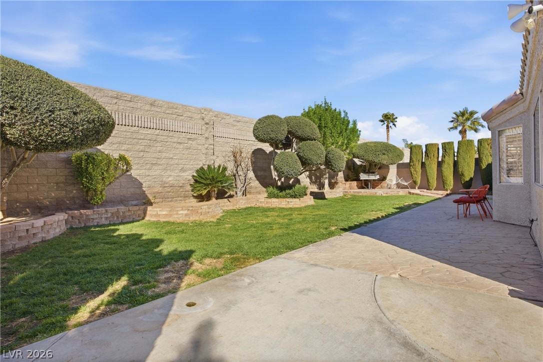 6109 Ocho Rios Street Las Vegas, NV 89130 - Photo 8 of 36 Fenced backyard featuring a patio area