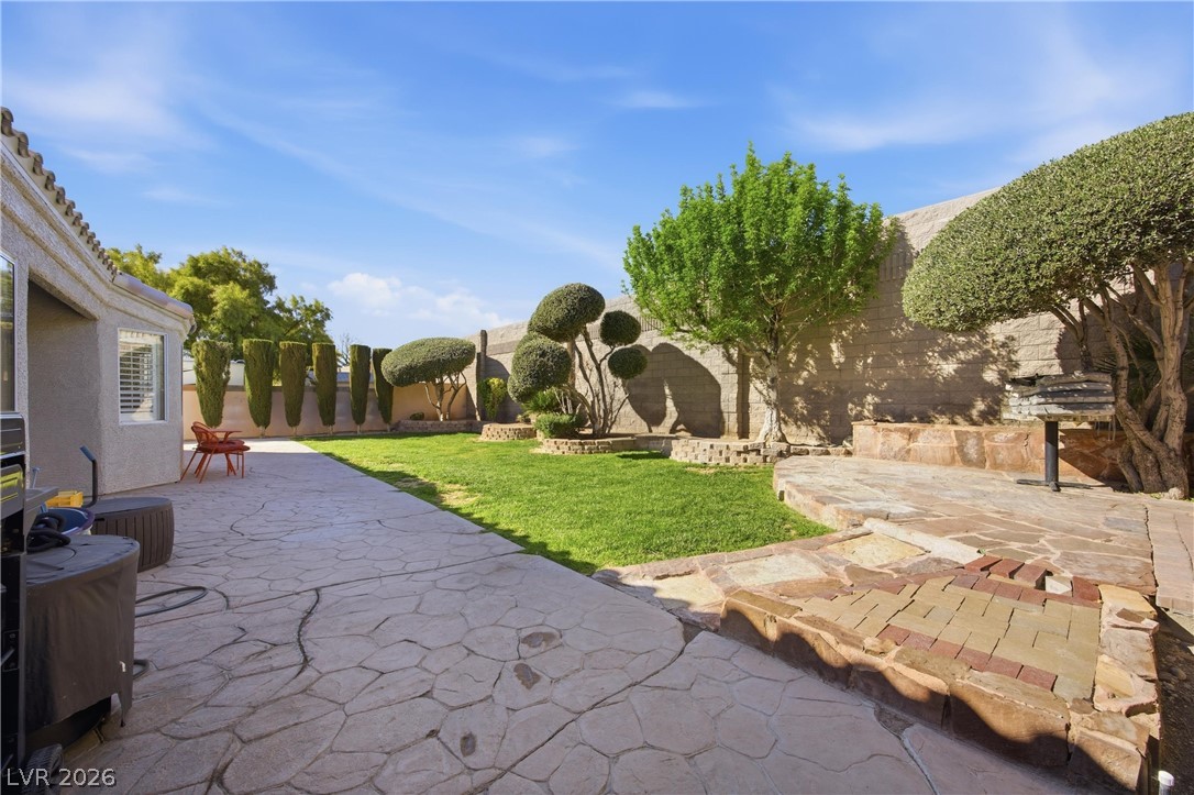 6109 Ocho Rios Street Las Vegas, NV 89130 - Photo 9 of 36 Fenced backyard featuring a patio area