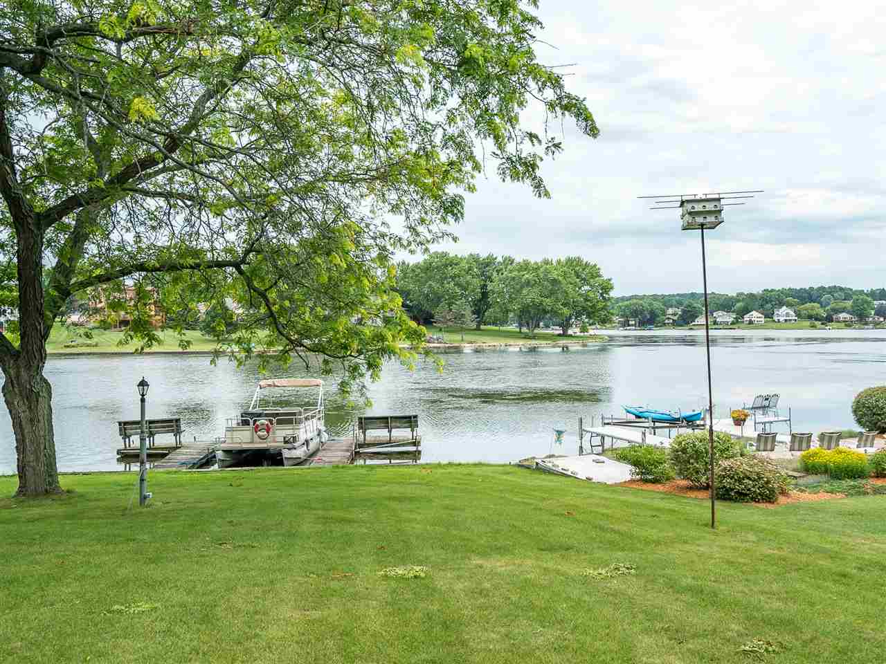 516 Baintree Road Davis, IL 61019 - Photo 3 of 25 a lake view with a bench and trees