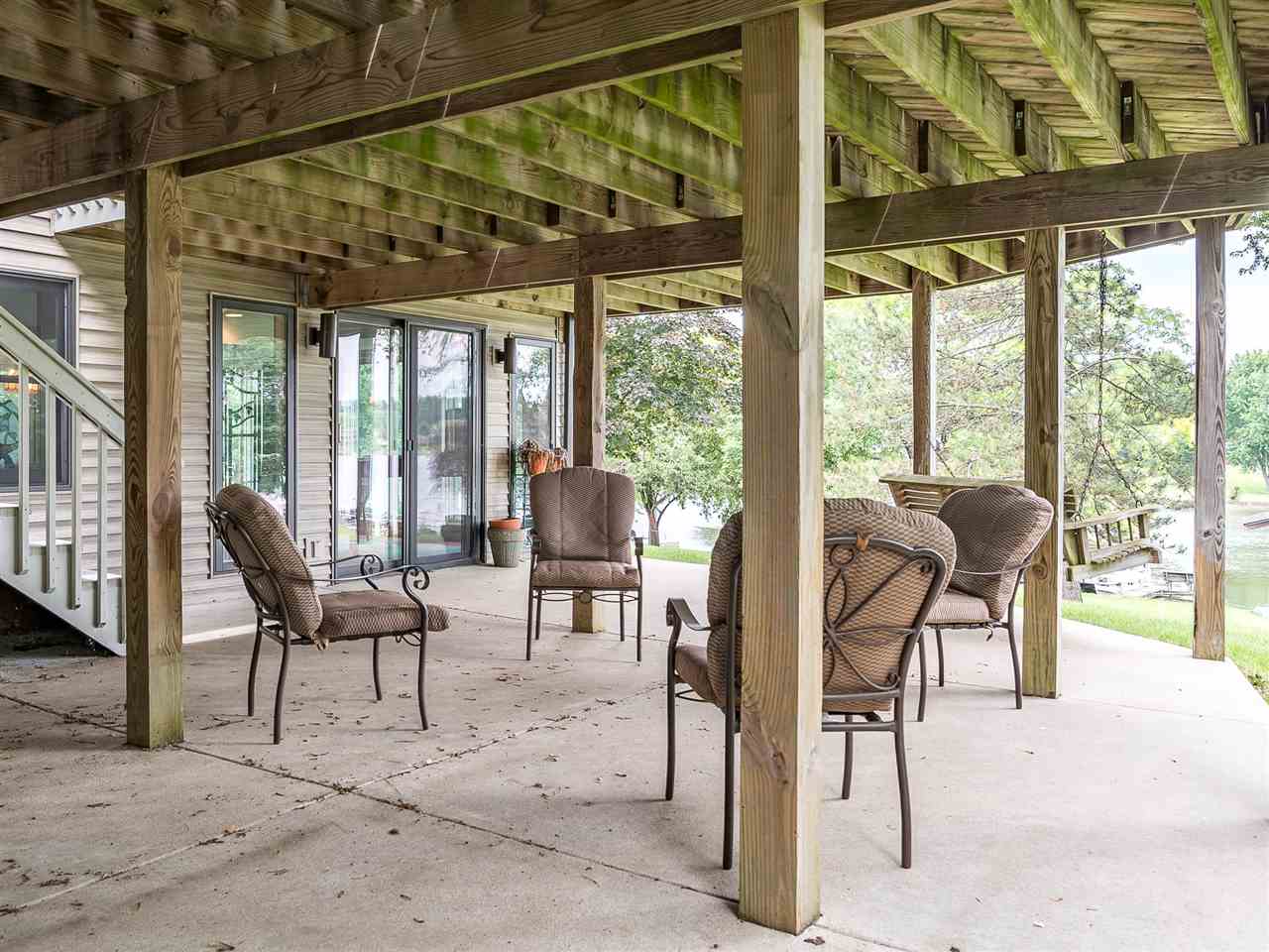 516 Baintree Road Davis, IL 61019 - Photo 6 of 25 a view of a porch with chairs and couches