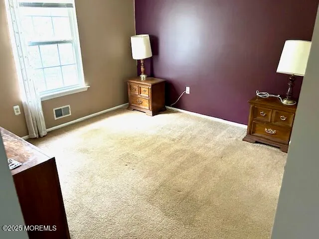 a bedroom with a bed and a desk