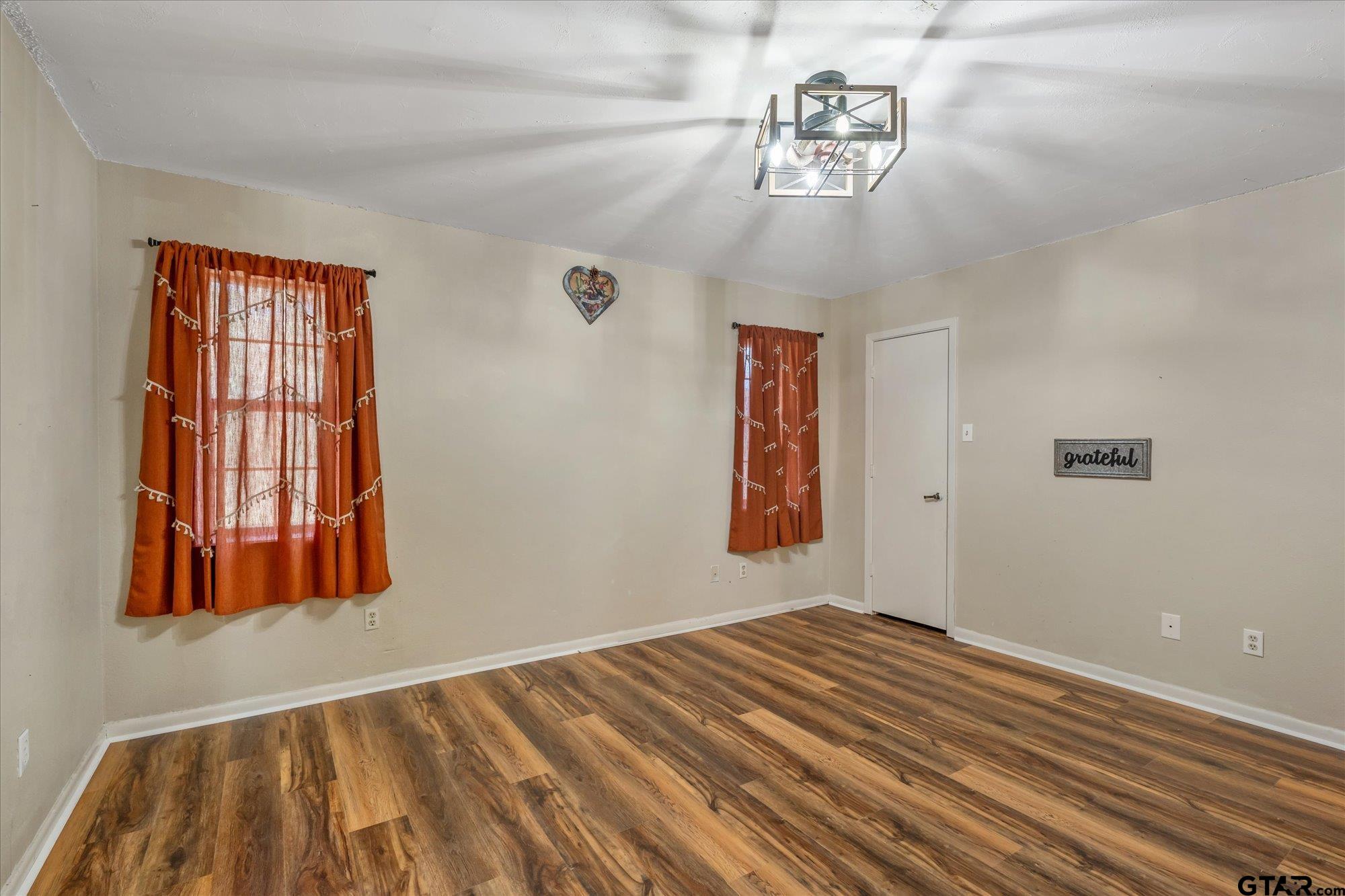 226 Colonial Circle Athens, TX 75751 - Photo 16 of 29 a view of a room with wooden floor and a window