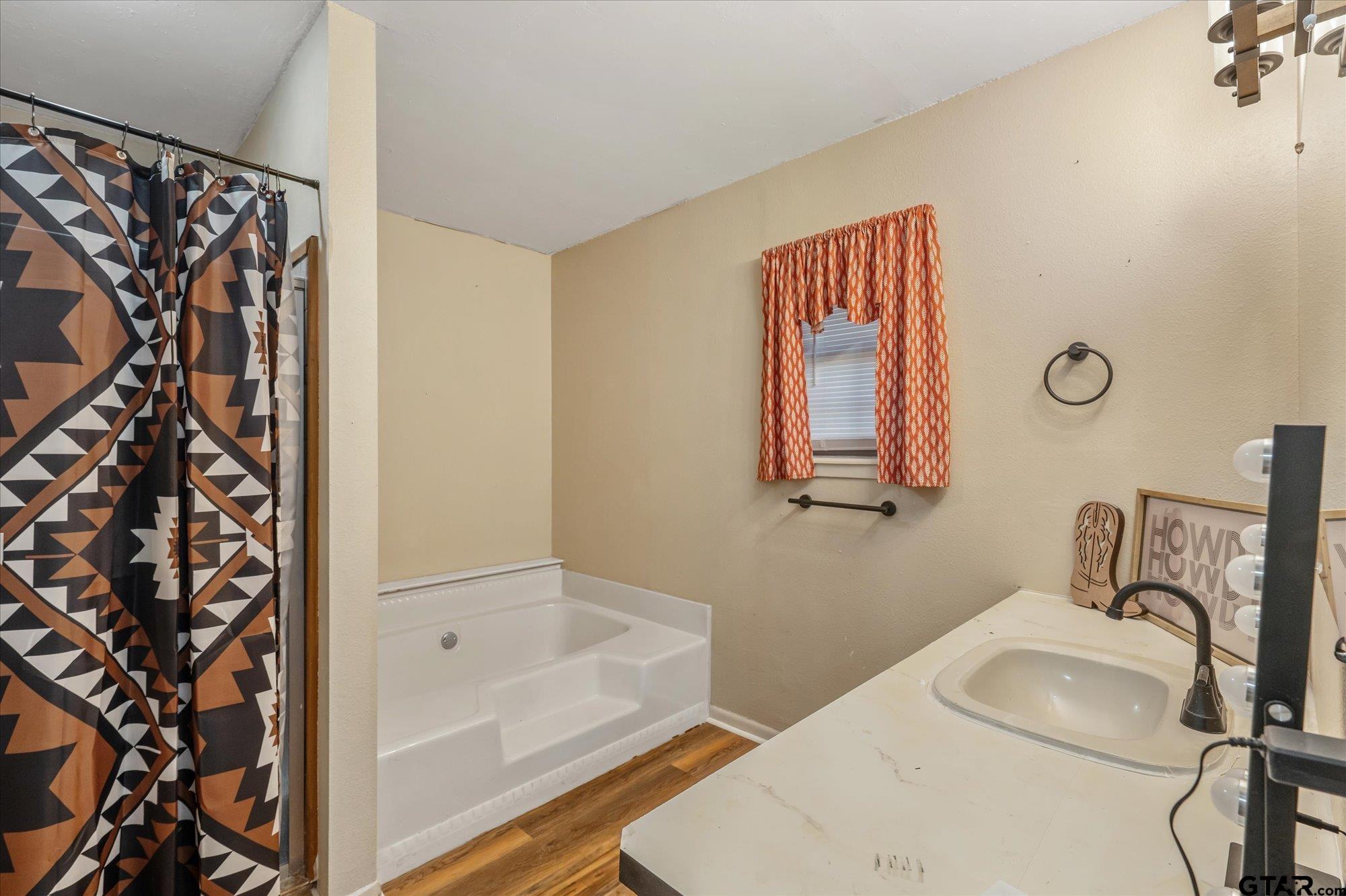 226 Colonial Circle Athens, TX 75751 - Photo 17 of 29 a bathroom with a sink and a bathtub