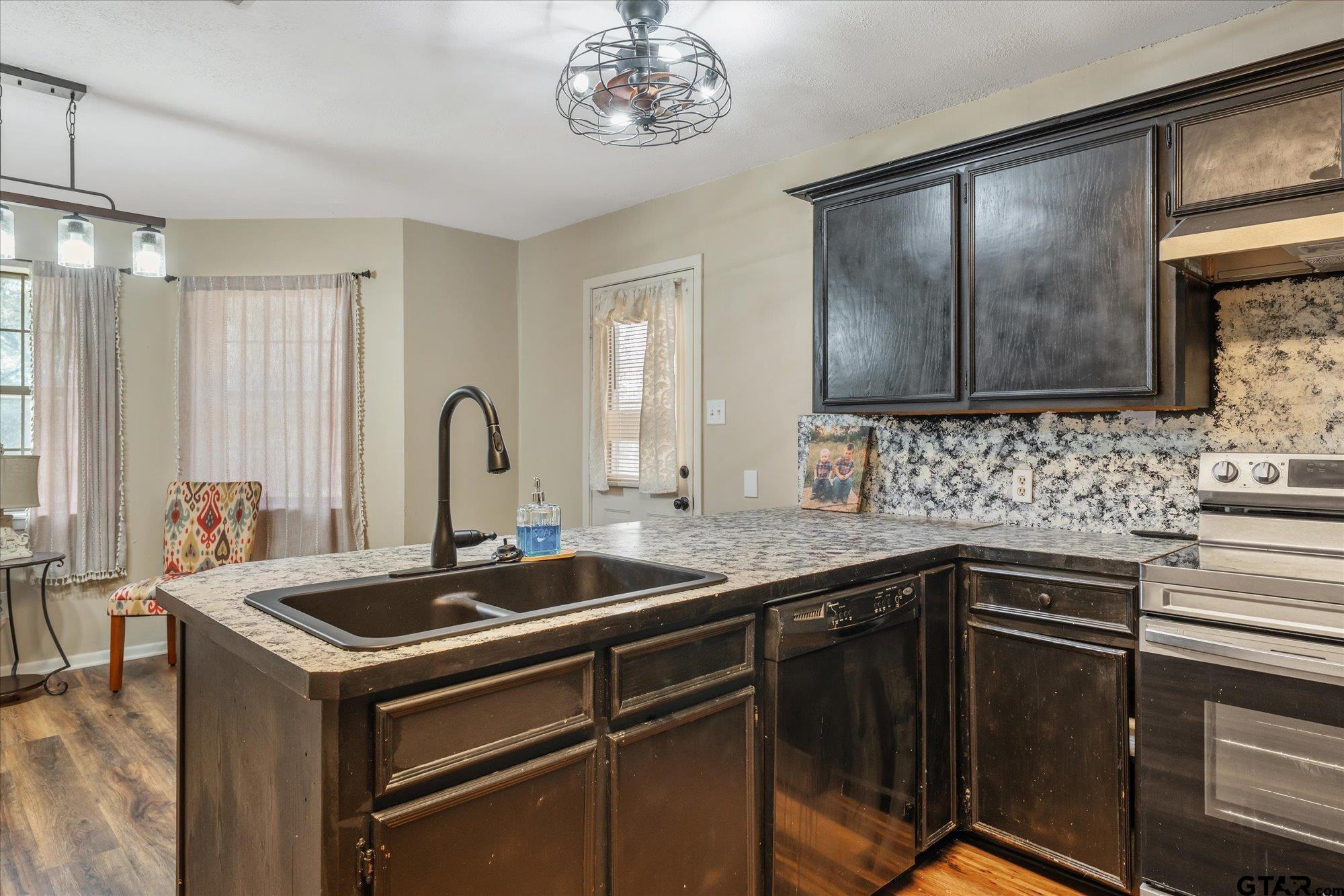 226 Colonial Circle Athens, TX 75751 - Photo 9 of 29 a kitchen with a sink cabinets and window