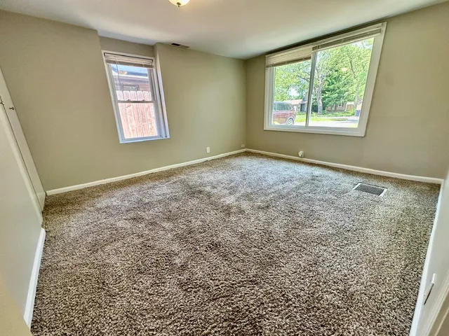 a view of an empty room and window