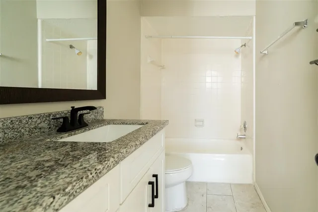 a view of an empty room and window with wooden floor