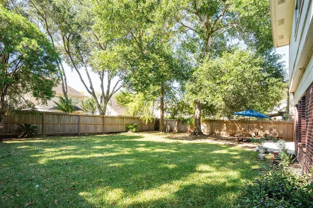 a view of a back yard of the house