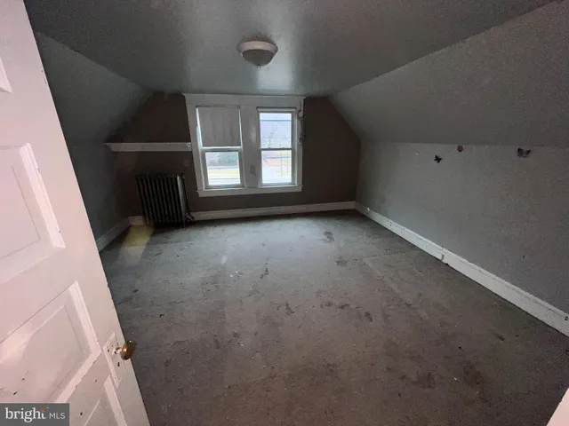 an empty room with staircase