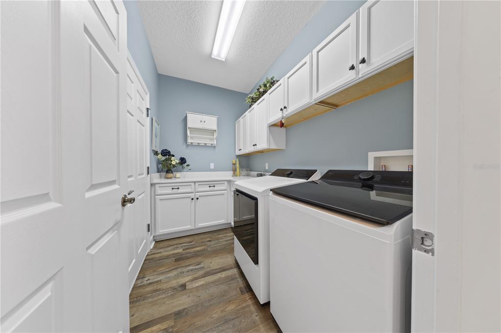 16948 Deer Island Road Tavares, FL 32778 - Photo 47 of 67 a kitchen with a sink and a stove top oven
