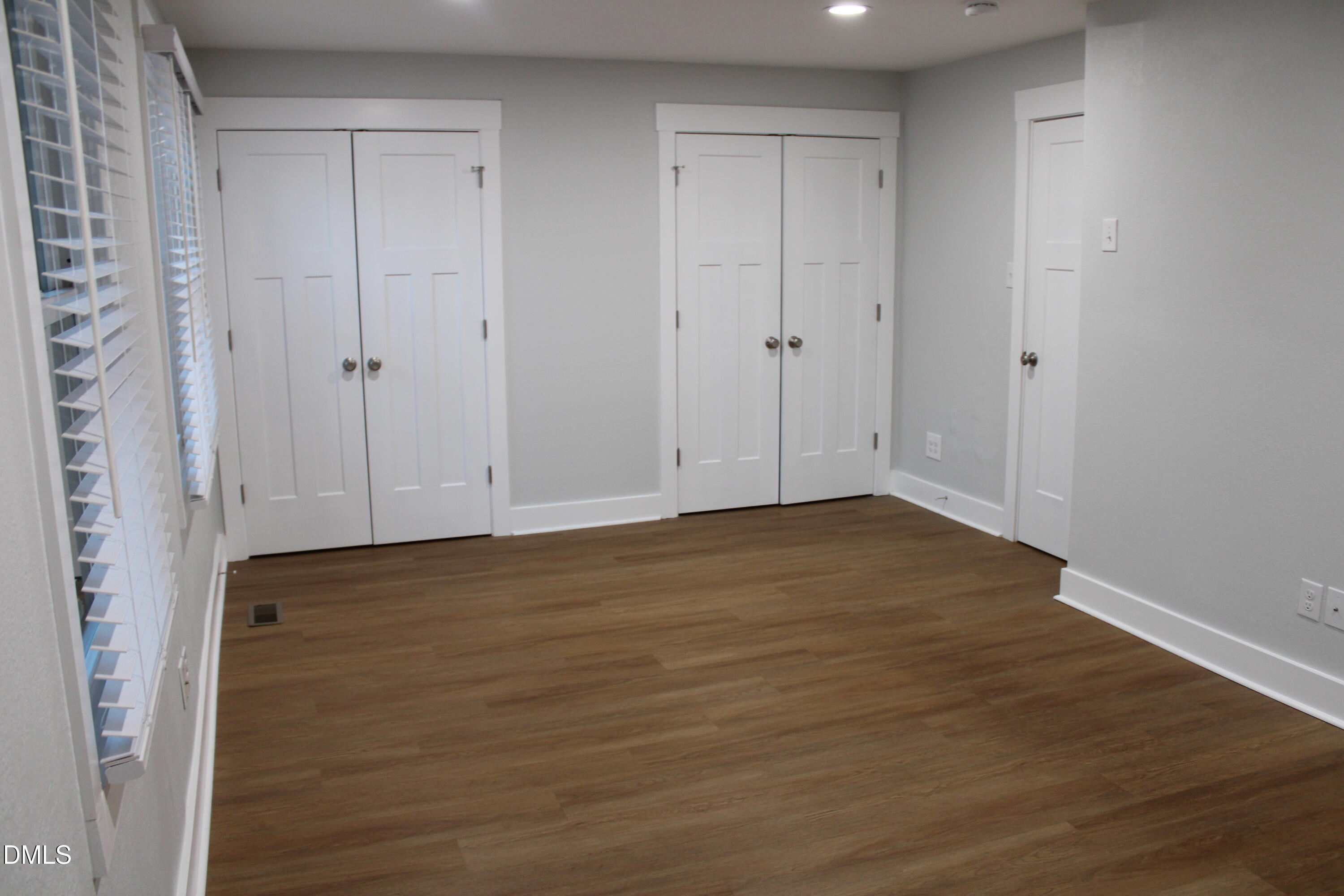 2812 Mayview Road Raleigh, NC 27607 - Photo 14 of 20 a view of an empty room with wooden floor