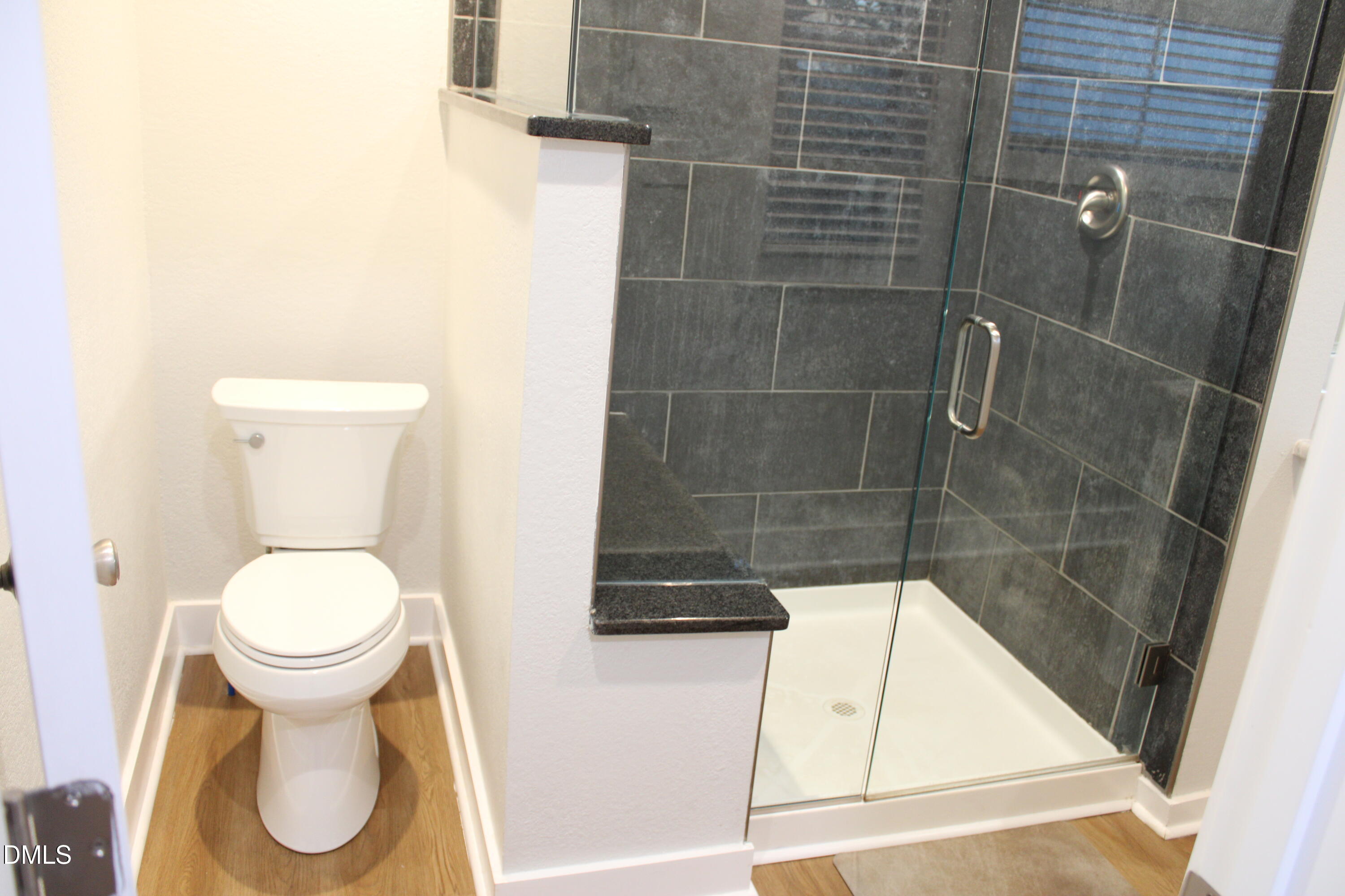 2812 Mayview Road Raleigh, NC 27607 - Photo 16 of 20 a bathroom with a toilet and a shower