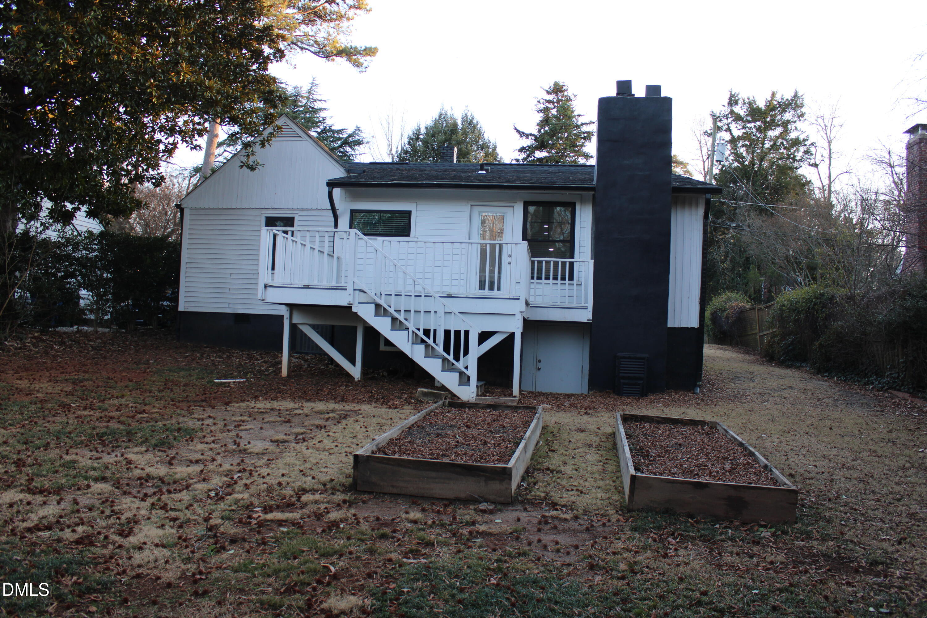 2812 Mayview Road Raleigh, NC 27607 - Photo 18 of 20 a view of a house with a yard chairs and roof