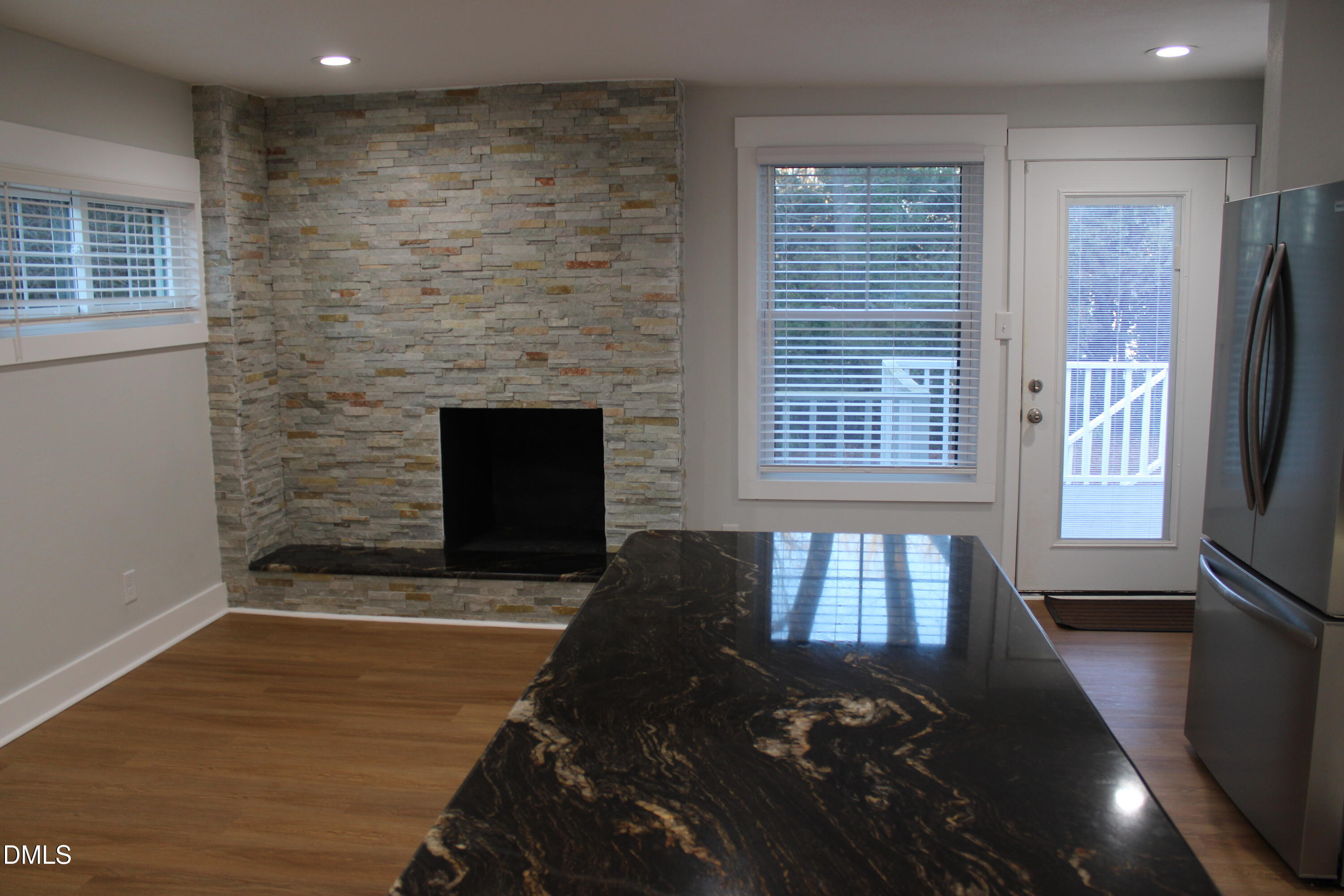 2812 Mayview Road Raleigh, NC 27607 - Photo 8 of 20 a living room with furniture and a fireplace