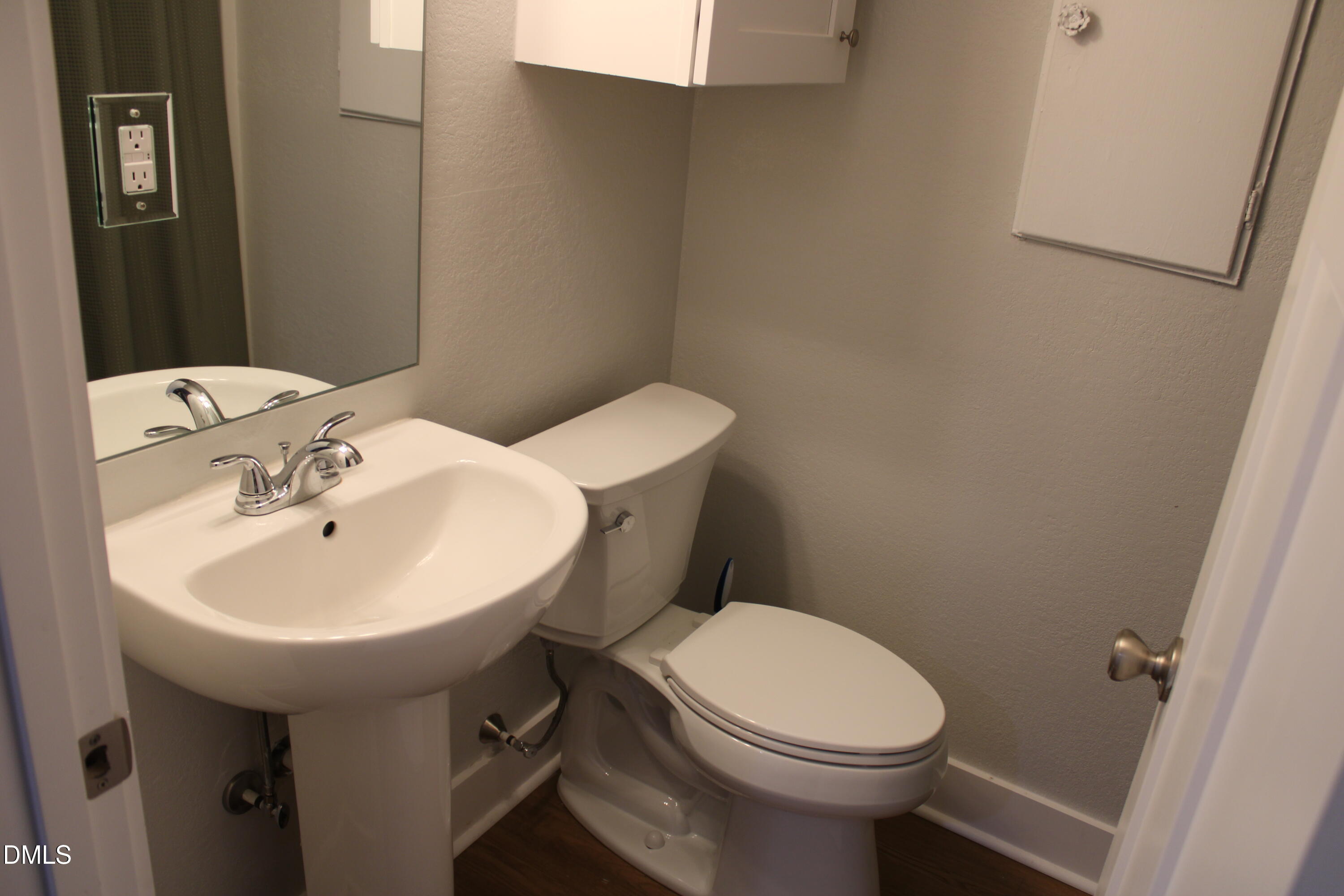 2812 Mayview Road Raleigh, NC 27607 - Photo 9 of 20 a bathroom with a sink a toilet and mirror