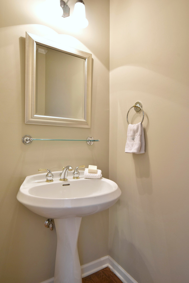 202 North Addison Avenue Elmhurst, IL 60126 - Photo 17 of 36 a bathroom with a sink a mirror and vanity