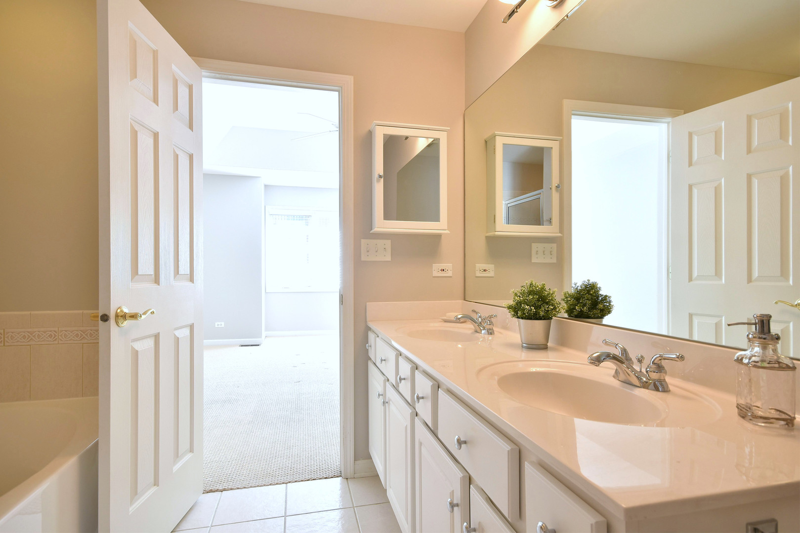 202 North Addison Avenue Elmhurst, IL 60126 - Photo 19 of 36 a bathroom with a double vanity sink a mirror and a shower