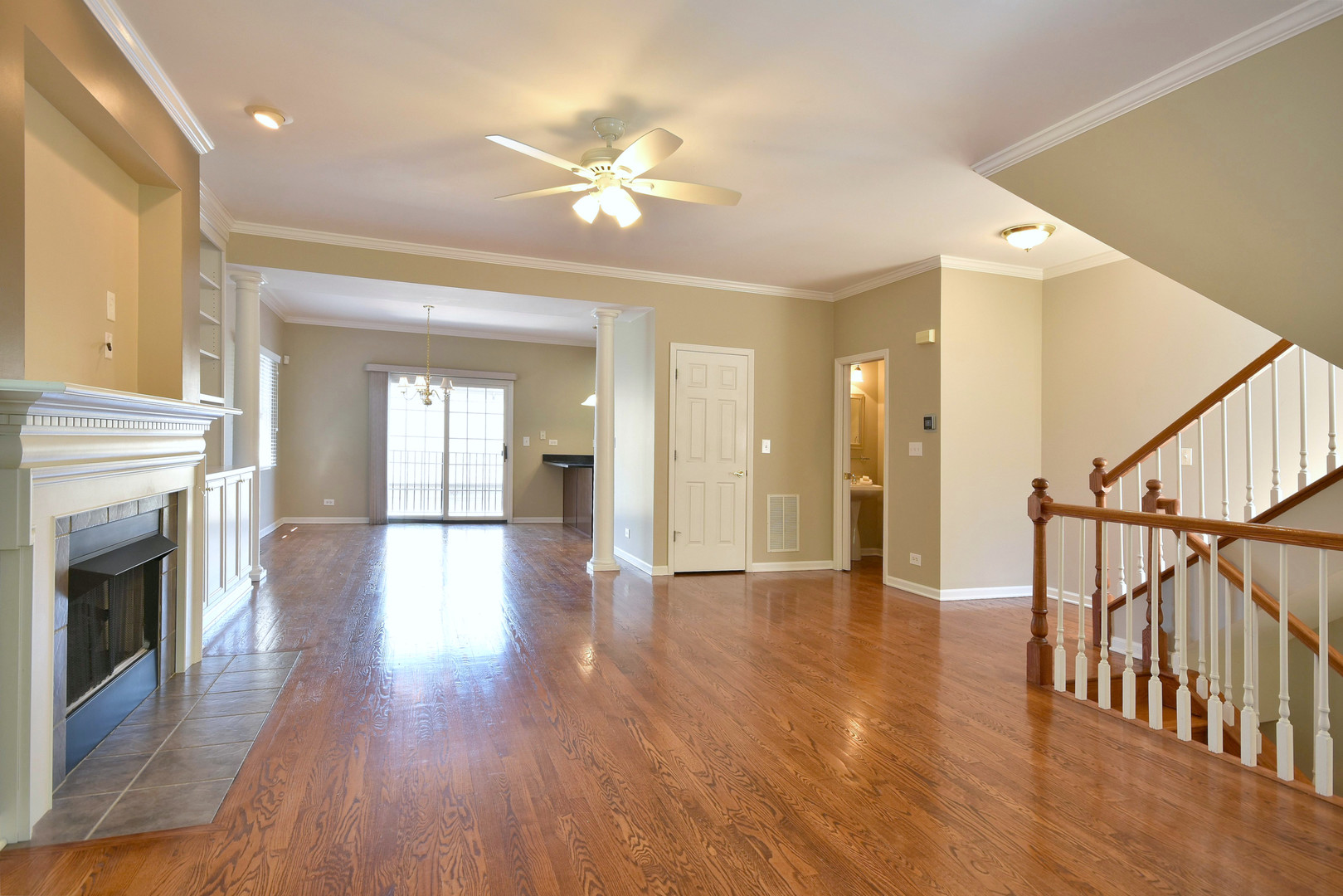 202 North Addison Avenue Elmhurst, IL 60126 - Photo 6 of 36 a view of an empty room with wooden floor and fireplace