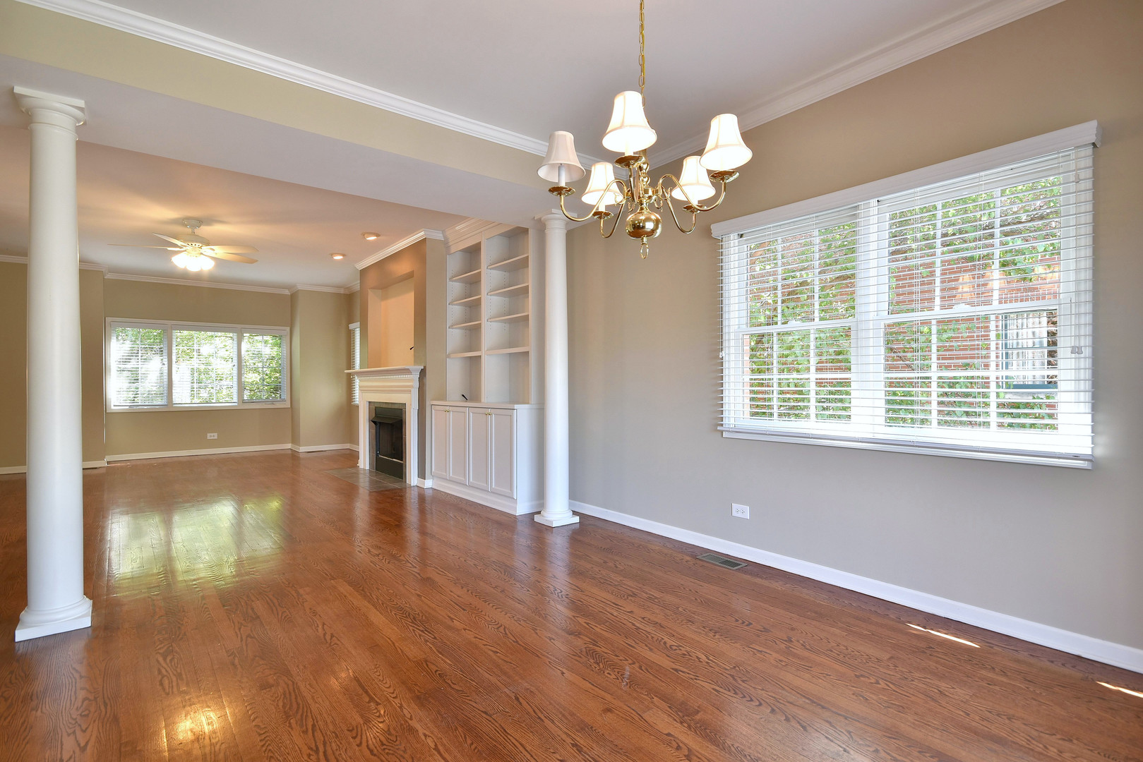 202 North Addison Avenue Elmhurst, IL 60126 - Photo 7 of 36 a view of a livingroom with a hardwood floor and a ceiling fan