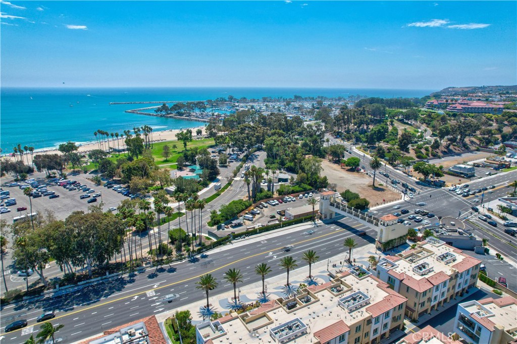 3185 Doheny Way Dana Point, CA 92629 - Photo 2 of 33 an aerial view of a city with lots of residential buildings and ocean view in back