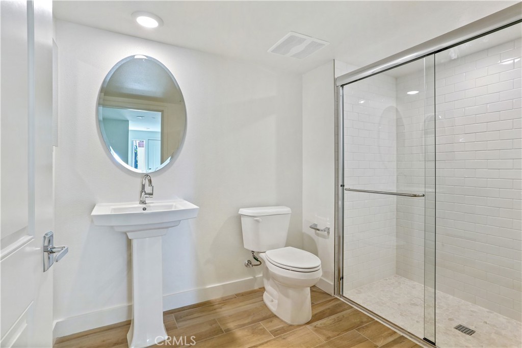 3185 Doheny Way Dana Point, CA 92629 - Photo 20 of 33 a bathroom with a sink toilet and a mirror