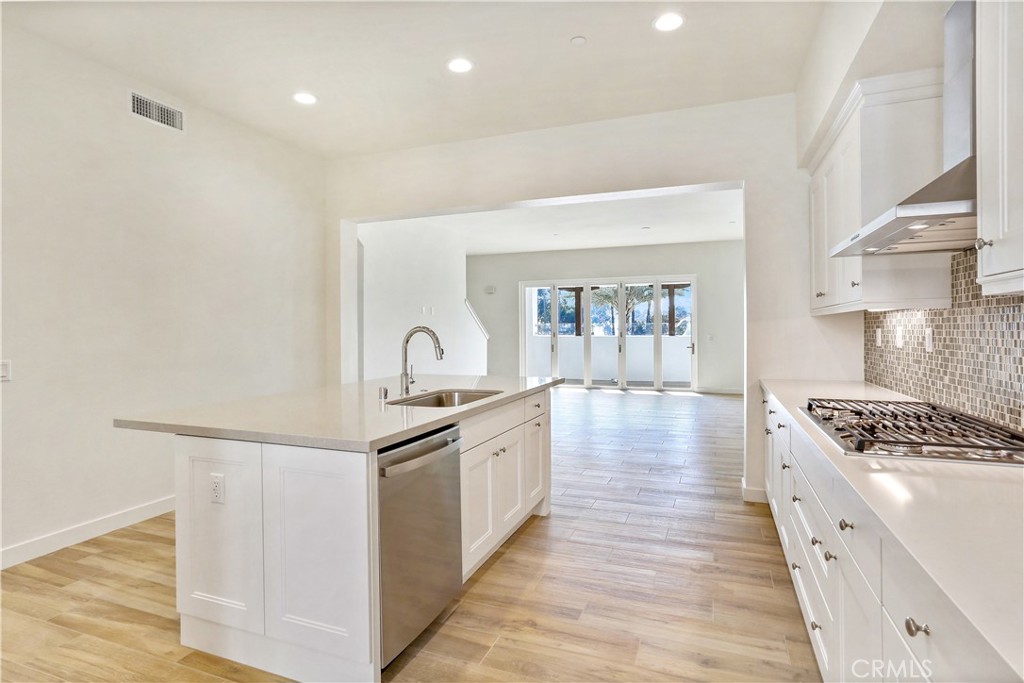 3185 Doheny Way Dana Point, CA 92629 - Photo 4 of 33 a kitchen with granite countertop a stove and a sink