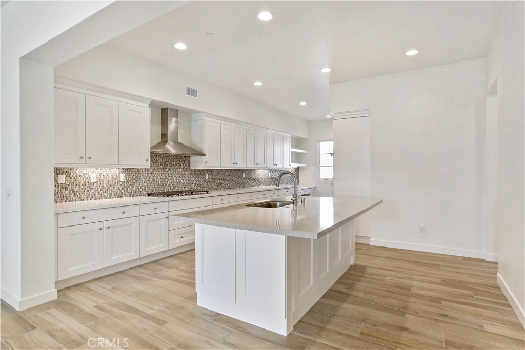 3185 Doheny Way Dana Point, CA 92629 - Photo 6 of 33 a kitchen with granite countertop a sink and cabinets