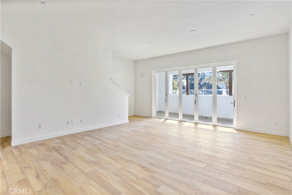 3185 Doheny Way Dana Point, CA 92629 - Photo 8 of 33 an empty room with wooden floor and window