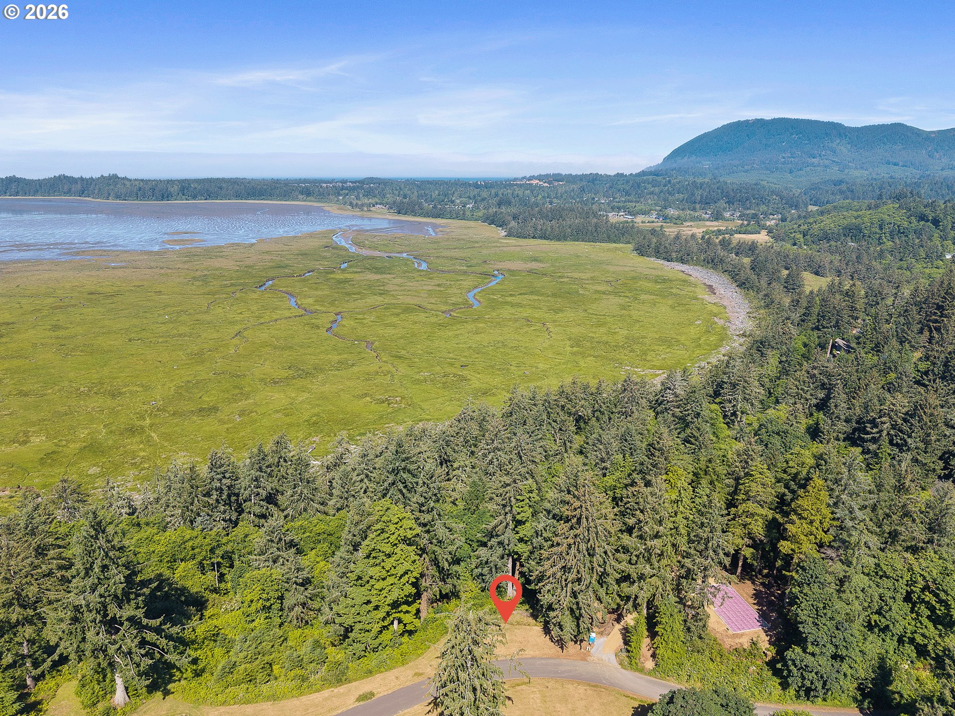 West Point Drive, Unit TL 2000 Nehalem, OR 97131 - Photo 5 of 12 a view of a lake with a mountain in the background
