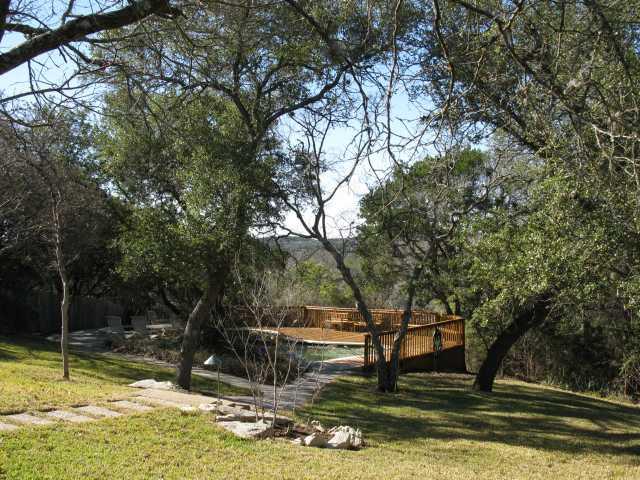 1603 The High Road Austin, TX 78746 - Photo 1 of 1 a view of swimming pool with a table and chairs