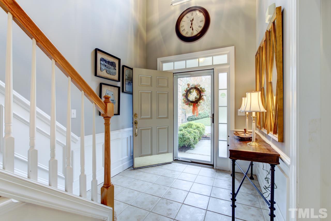 3743 Old Post Road Raleigh, NC 27612 - Photo 2 of 25 a view of an entryway with wooden floor and door