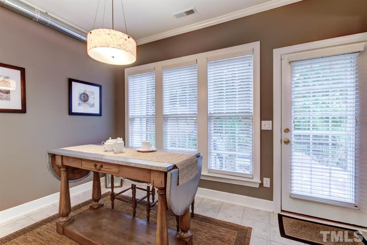3743 Old Post Road Raleigh, NC 27612 - Photo 12 of 25 a view of a dining room with furniture window and wooden floor