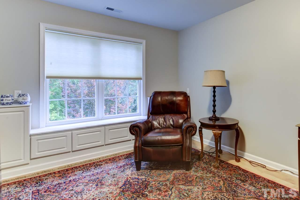 3743 Old Post Road Raleigh, NC 27612 - Photo 19 of 25 a living room with furniture and a window