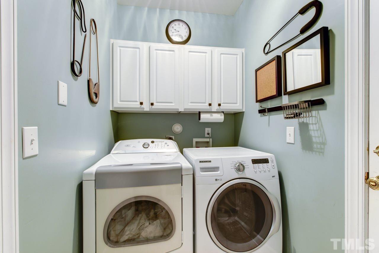 3743 Old Post Road Raleigh, NC 27612 - Photo 22 of 25 a utility room with dryer and washer